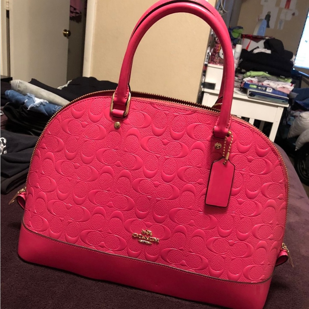 Coach medium size purse in pink.